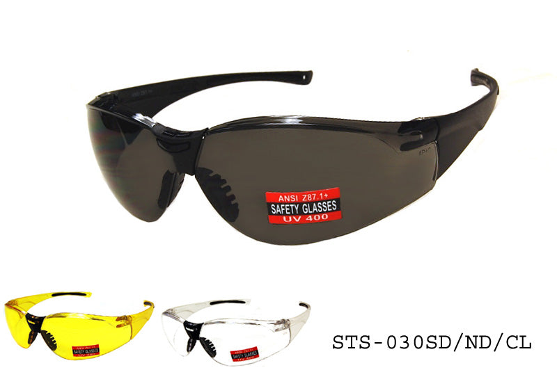 A pair of safety sunglasses labeled STS-030SD/ND/CL by APTCINC. The glasses feature a sleek design suitable for driving, with non-distorting lenses. They are designed for safety and specialty use, reflecting the brand's focus on protection. The image is part of a catalog for March 2024, and the product is noted for its ND (non-distorting) driving lens.