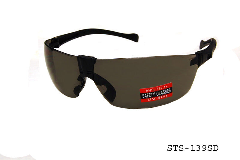 Wholesale safety glasses with wraparound clear lenses, black plastic frame, and adjustable nose pads for secure fit.