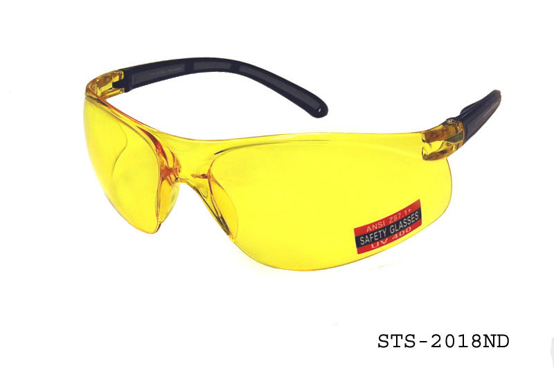 A pair of sleek, modern safety sunglasses designed for optimal eye protection. The frames are black with a wrap-around style, and the lenses are tinted, providing a sporty look. The product is labeled as STS-2018ND by APTCINC, indicating its model number.