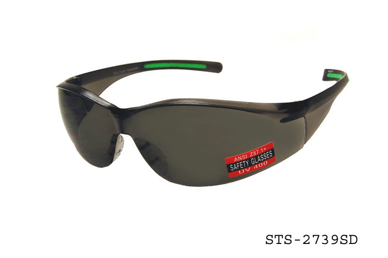 A pair of sleek safety sunglasses featuring a wraparound design for enhanced protection. The lenses are tinted for glare reduction, and the frame is made of durable material. The product is labeled as STS-2739SD by APTCINC, designed for safety use.